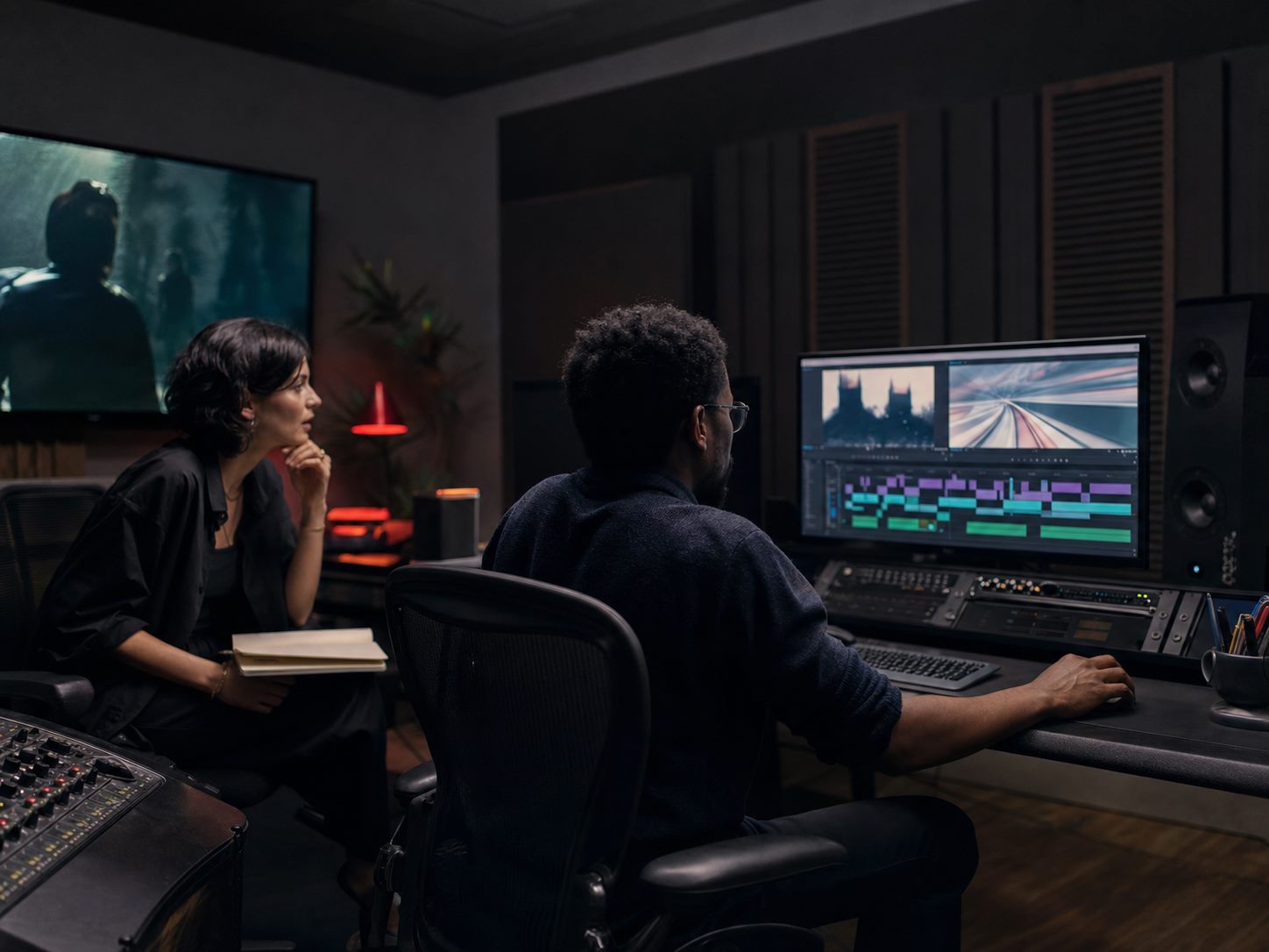 Creative Riots editors working inside a production suite